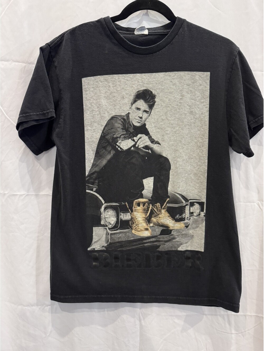 Vintage 2012 Justin Bieber official merchandise graphic tee is a black t-shirt